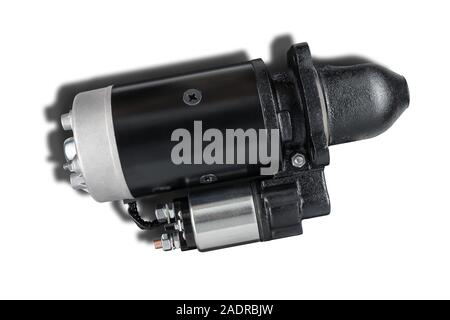 3kW starter motor for tractor or other agricultural machinery placed on white isolated background with shadow. Stock Photo