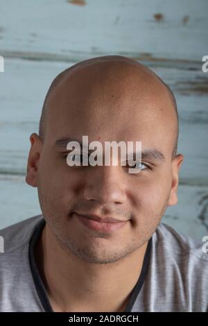 Attractive bald man looking at camera Stock Photo