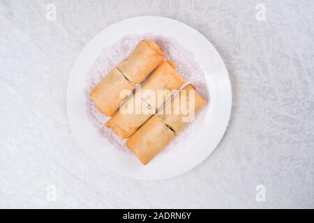 Spring Roll also known as Egg Roll isolated on white. Stock Photo