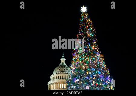 Washington, DC, USA. 4th Dec, 2019. The Capitol Christmas Tree is lit on the west front lawn of the Capitol in Washington, DC, the United States, Dec. 4, 2019. The Capitol Christmas Tree has been a tradition since 1964. Credit: Ting Shen/Xinhua/Alamy Live News Stock Photo