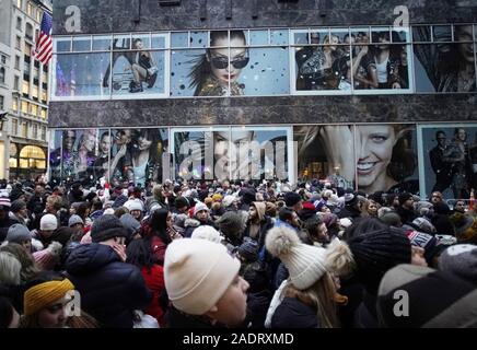 New York, United States. 4th Dec, 2019. Crowds of people gather near Rockefeller Center and wait for the Christmas tree lights to turn on for the first time at the 87th annual Christmas Tree Lighting Ceremony at Rockefeller Center in New York City on Wednesday, December 4, 2019. Photo by John Angelillo/UPI Credit: UPI/Alamy Live News Stock Photo