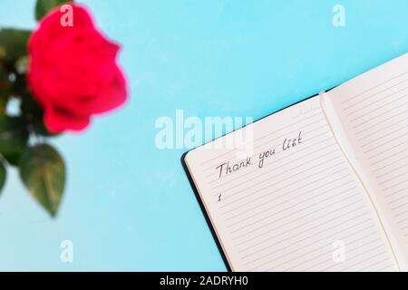 Top view of gratitude journal with handwritten words Thank you list Stock Photo