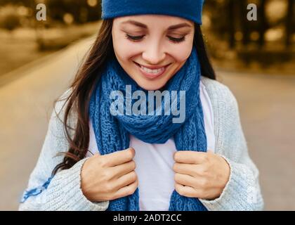 Color of the year blue. fashion colors autumn-winter 2019-2020 knits pile. Beautiful girl outside in hat and scarf. Warm cozy home and fashion colors concept. Horizontal Stock Photo