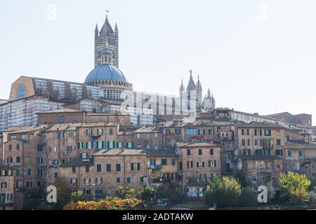 Siena Italy, view of the Duomo and surrounding buildings on the skyline of the city of Siena in Tuscany, Italy. Stock Photo
