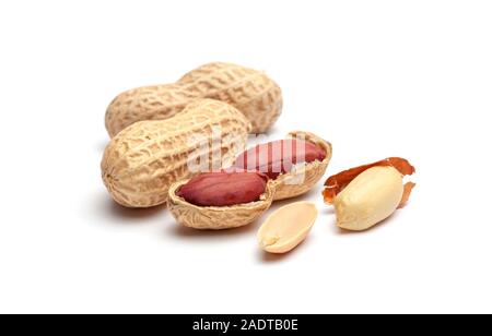 Dried peanuts in peel closeup isolated on white background. Stock Photo