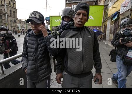 La Paz, La Paz, Bolivia. 13th Nov, 2019. Clashes in La Paz/Bolivia. Arrested protesters. Demonstrators have taken to the streets in Bolivia after the counting of votes on October 2019 presidential election descended into controversy about a massive fraud from the Evo Morales MAS party.The country's opposition has accused the government of President Evo Morales of fraud after the count was mysteriously suspended for 24 hours during the votes counting while pointing to the need for a December run-off round between the incumbent and his closest rival Carlos Mesa. But when the count restar Stock Photo