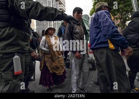 La Paz, La Paz, Bolivia. 13th Nov, 2019. Clashes in La Paz/Bolivia. Arrested protesters.Demonstrators have taken to the streets in Bolivia after the counting of votes on October 2019 presidential election descended into controversy about a massive fraud from the Evo Morales MAS party.The country's opposition has accused the government of President Evo Morales of fraud after the count was mysteriously suspended for 24 hours during the votes counting while pointing to the need for a December run-off round between the incumbent and his closest rival Carlos Mesa. But when the count restart Stock Photo