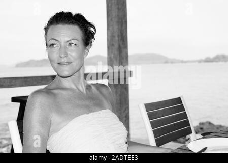 Mature beautiful tourist woman at the beach resort Stock Photo