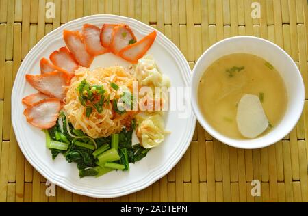 dried thin rice noodle topping barbecue pork and dumpling with soup Stock Photo