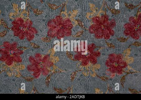 Detail of blue fabric with red floral patterns Stock Photo