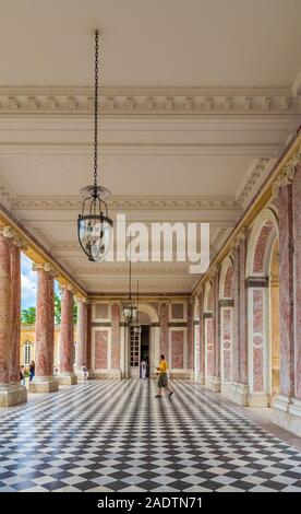 Nice view of the gallery, a sheltered colonnade, connecting the two wings of the Grand Trianon Palace in Versailles. The palace with its pink marble... Stock Photo