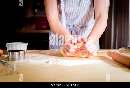 chef kneads dough for baking, concept cooking, bakery Stock Photo