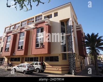 Building of Jean Piaget University and palm tree in african city