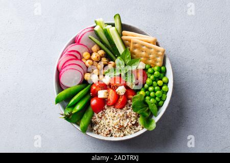 Healthy vegetarian salad. Buddha bowl. Grey stone background. Top view. Close up Stock Photo