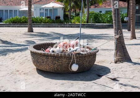 Vietnamese woven coracle  bamboo basket boat on beach Hoi Ann Vietnam Stock Photo