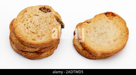 Mini round toasts of bread with raisins. Several units. Isolated on white background. Stock Photo