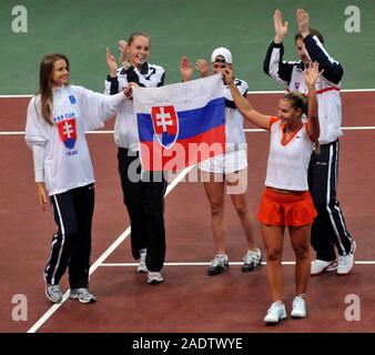 Bratislava, Slovakia. 08th Feb, 2009. ***FILE PHOTO*** Slovakian player Dominika Cibulkova, right, waves to the fans with her teammates, left to right, Daniela Hantuchova, Magdalena Rybarikova, Lenka Wienerova, captain Matej Liptak after her win over Belgian Yanina Wickmayer in the third singles of World Group II 1st round Fed Cup match Slovakia vs Belgium in Bratislava on Sunday, January 8, 2009. Slovakia defeated Belgium 3:0. Credit: Jan Koller/CTK Photo/Alamy Live News Stock Photo