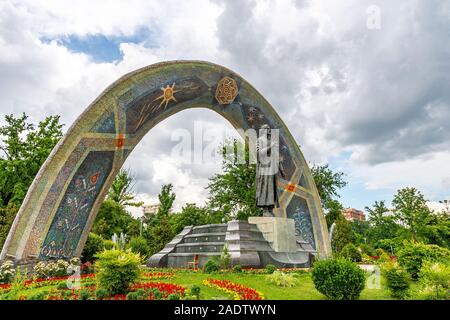 Dushanbe Abu Abdullah Rudaki Park Statue Picturesque Side View on a Cloudy Rainy Day