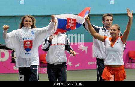 Bratislava, Slovakia. 08th Feb, 2009. ***FILE PHOTO*** Slovakian player Dominika Cibulkova, right, waves to the fans with her teammate Daniela Hantuchova, left, and captain Matej Liptak after her win over Belgian Yanina Wickmayer in the third singles of World Group II 1st round Fed Cup match Slovakia vs Belgium in Bratislava on Sunday, January 8, 2009. Slovakia defeated Belgium 3:0. Credit: Jakub Sukup/CTK Photo/Alamy Live News Stock Photo