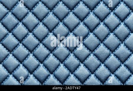 Faux leather with embossed blue color. Background texture, top view. Close up. Stock Photo