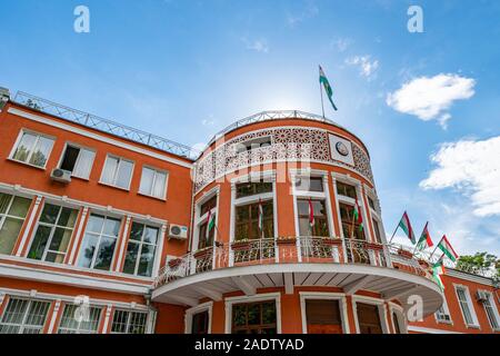 Dushanbe Ministry of Justice Building Breathtaking Picturesque View with Waving Tajikistan Flags on a Sunny Blue Sky Day