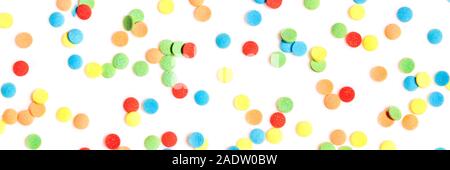 Header, colorful sugar confetti or sprinkles on white background, concept party and celebrate Stock Photo