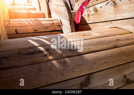 Large wooden cable reels, stored in a factory of electric cables. Stock Photo