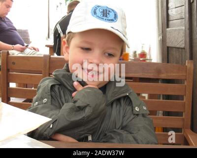 A boy portrait. Sillly face expression, wide eyes, funny lips. Stock Photo