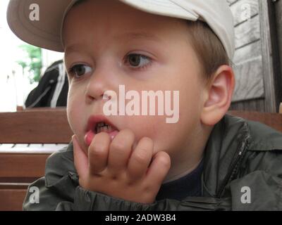 A boy portrait. Sillly face expression, wide eyes, funny lips. Stock Photo