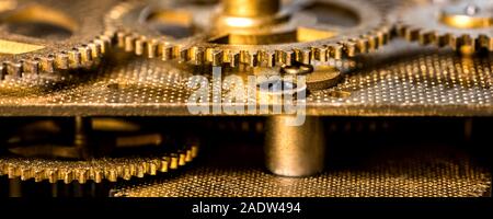 Header, closeup of a analogous clockwork, gears and brassy components Stock Photo