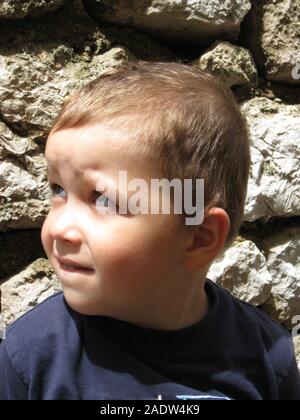 A boy portrait. Sillly face expression, wide eyes, funny lips. Stock Photo