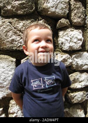 A boy portrait. Sillly face expression, wide eyes, funny lips. Stock Photo