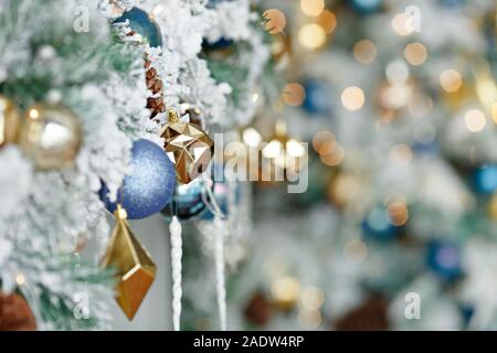 Multi-colored Christmas toys close-up on a background of bokeh lights. Close-upplace for text Stock Photo