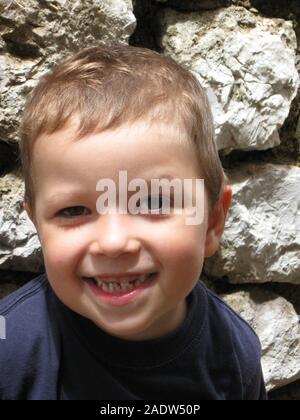 A boy portrait. Sillly face expression, wide eyes, funny lips. Stock Photo