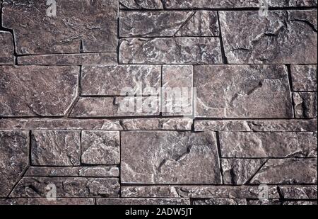 A fragment of wall covered with ceramic tiles Stock Photo