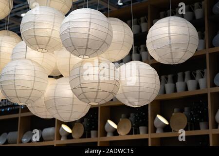 Many paper lanterns. Lighted paper lanterns inside of building, decoration. Stock Photo