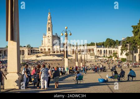 Fatima, Portugal - May 12, 2019: View of the Shrine of Fatima with pilgrims waiting for the procession of the candles. Stock Photo