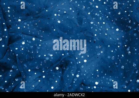 Blue tulle with gold brilliant sequins Christmas, new year background Stock Photo