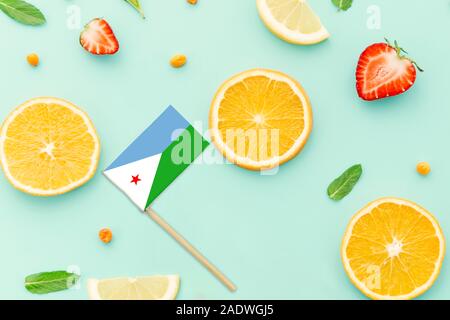 Djibouti Paper Stick Flag. National summer fruits concept, local food market. Vegetarian theme. Stock Photo