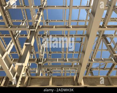 Metal frame of prefabricated multi-storey building. Metal pillars, beams and diagonal bracings