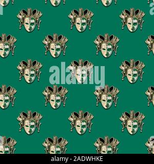 Seamless pattern venetian theatrical green mask on a green background, flat lay Stock Photo