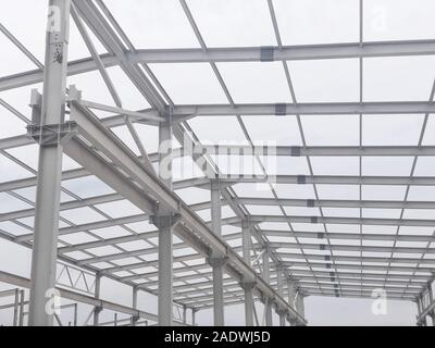 Metal frame of prefabricated multi-storey building. Metal pillars, beams and diagonal bracings
