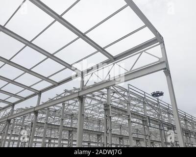 Metal frame of prefabricated multi-storey building. Metal pillars, beams and diagonal bracings