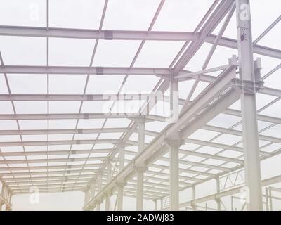 Metal frame of prefabricated multi-storey building. Metal pillars, beams and diagonal bracings