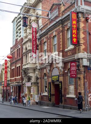 Pedestrians and shoppers in Chinatown Little Bourke Street Melbourne Victoria Australia. Stock Photo
