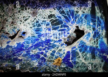 Vandalized windscreen on abandoned car Stock Photo