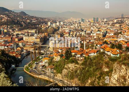 An elevated aerial view daytime view of Sarajevo, capital of Bosnia and Herzegovina surrounded by the Dinaric Alps and the Miljacka River in view Stock Photo