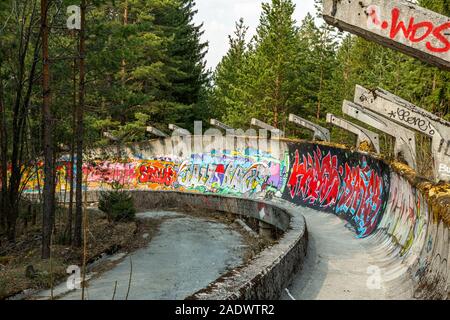 1984 Winter Olympics,  XIV Olympic Winter Games ; Bobsleigh Bobsled Luge course lies derelict and covered in colourful graffiti  Sarajevo Yugoslavia Stock Photo