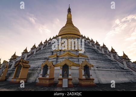 Bago, Myanmar - February 05, 2018: Mahazedi Pagoda at sunset - this is one of the most prominent Buddhist temples in Bago.