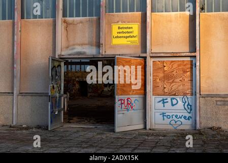 Magdeburg, Germany. 05th Dec, 2019. 'No trespassing! Life threatening' is written at the entrance of the hyparschale. The listed building has been closed since 1997 due to dilapidation. This week, the 17 million Euro restructuring measures have begun. The Hyparschale is to become a venue for conferences, congresses and cultural events. According to the plan, the construction work should be completed by the summer of 2022. Credit: Stephan Schulz/dpa-Zentralbild/ZB/dpa/Alamy Live News Stock Photo